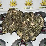 Dense cannabis buds with purple and green hues, high-quality flower for sale.